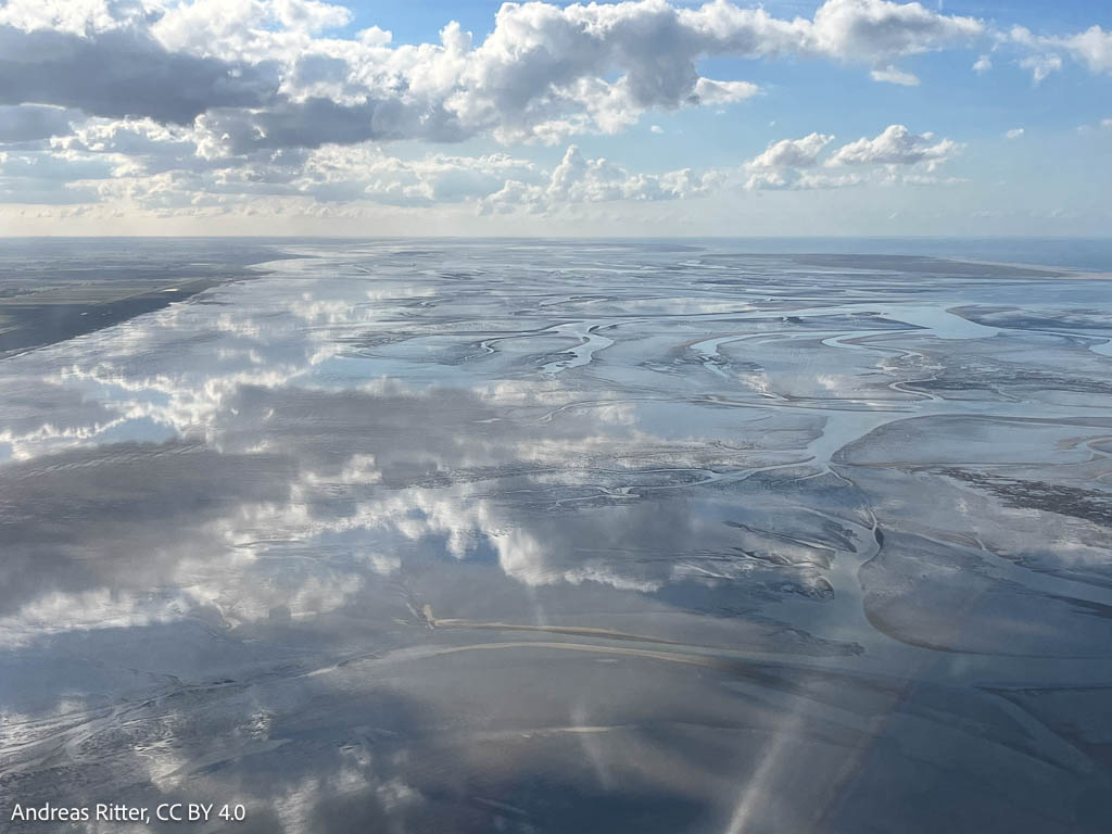 clouds mirroring in the glassy water